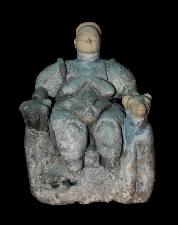 Photograph of female figurine, with missing parts reconstructed in clay, widely known as the 'Mother Goddess.'